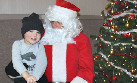 ​Santa Claus visits with children at Tiverton Lions Christmas Bazaar