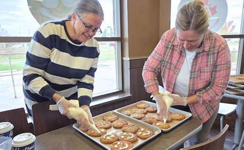 Volunteers icing smiles for local Big Brothers and Big Sisters